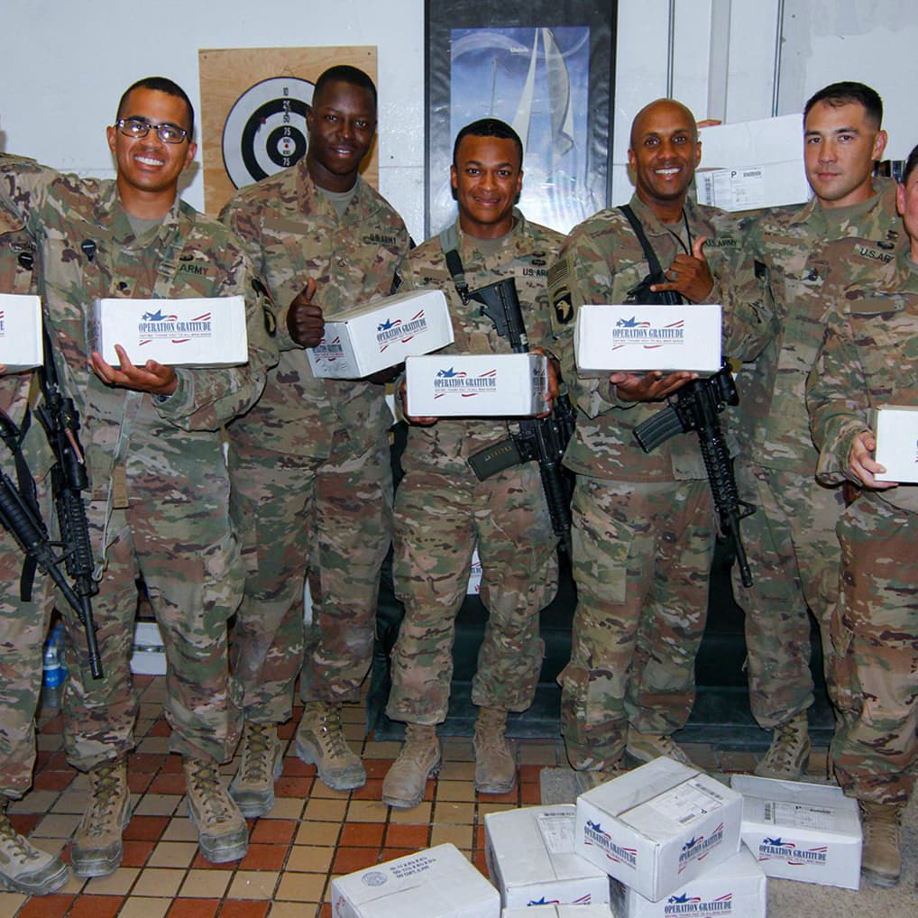 Service members receiving care packages